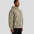 A hooded sweatshirt in a faded camo pattern featuring a front pocket and a relaxed fit. It has a logo on it.