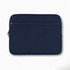 A navy neoprene laptop sleeve for 16-inch laptops featuring a zippered pocket and a subtle logo.
