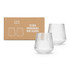 A gift set featuring two clear, unbreakable wine glasses with a ribbed design, packaged in a box with branding.
