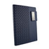 A navy Nexus Notebook featuring a textured design and a metal clip on the cover. It has a sleek, modern appearance.