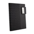 A black Nexus Notebook with a textured, woven cover and a detachable clip for securing pages.