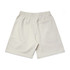 Light beige shorts with an elastic waistband and a small back pocket. Features a logo on the fabric.
