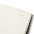 A Moleskine 2027 planner with a dark cover and cream pages, featuring a weekly layout. It has branding on the cover.