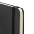 A black Moleskine 2027 Planner with a flexible cover and an elastic band closure. The edges are white.