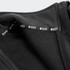 A softshell jacket featuring a fleece interior, in black, with visible branding inside the collar.