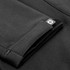 A black softshell jacket featuring a logo on the sleeve, showcasing a stylish and modern design.