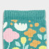 A pair of teal kids' socks featuring a floral pattern in pink, yellow, and orange. The socks have a soft knitted texture.