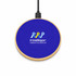 A wireless charger with a circular design, featuring a blue suede top and wooden base, including a logo.