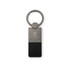 A silver keytag with a black leather attachment and a logo on the metal part.
