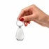 A hand holding a silver keytag with a smooth, teardrop shape and a metal ring for attachment.