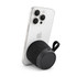 A black portable speaker is attached to a smartphone, featuring a textured surface and a strap.
