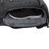 A black backpack with a separate compartment holding a pair of black shoes, featuring a small logo.