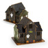A wooden model of a spooky house in green and brown, featuring ghosts, pumpkins, and Halloween decorations.