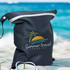 A black wet bag with a zipper, featuring a logo with a sunset and palm tree against a beach background.