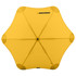 A yellow BLUNT Classic Umbrella with a unique star shape and a central black button, featuring branding.