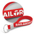 A red silicone key ring with embossed design and a metal key ring attachment, featuring a logo.