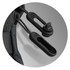 Close-up of black toggles on a green backpack, featuring adjustable cord locks for securing contents.