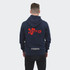 A navy unisex hoodie featuring a red logo and text on the back, with a grey bottom band and a hood.