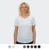 A white women's T-shirt displayed on a model, featuring a round neckline and short sleeves. Includes a logo.