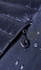 A close-up of a dark jacket's zipper with water droplets, featuring a small pull tab and a smooth fabric texture.