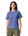 A woman wearing a purple t-shirt with short sleeves, paired with green pants. The shirt features a logo.