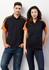 A black polo shirt with orange accents, featuring a logo, displayed on both a male and female model.