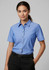 A women's short sleeve button-up shirt in chambray blue with a chest pocket and a subtle logo.
