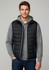 A man is wearing a black puffer vest over a grey hoodie, paired with jeans. The vest features a logo.
