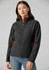 A black soft shell jacket with red accents, featuring a high collar and zippered pockets, modelled by a woman.