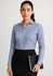 A women's long sleeve button-up shirt in blue, paired with a black skirt, held with a black notebook.