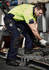 Men's ultralite multi-pocket pants in navy with multiple pockets, worn by a man in a high-visibility shirt.