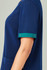 A navy blue unisex scrub top with short sleeves featuring a teal accent on the cuffs. It has a pocket on the front and a logo.