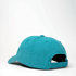A teal cotton canvas unstructured 6-panel cap featuring a back strap and a logo.