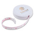 A white Tornado tape measure with a retractable pink measuring tape. It features a logo on the lid.