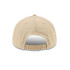 A beige high profile 5 panel snapback trucker cap featuring an adjustable strap and a rear vented design.