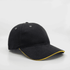 A black cap with a yellow trim, featuring ventilation holes and a curved peak. It has a logo on the front.
