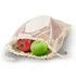 A cotton produce bag in natural colour, filled with red and green apples, resting on a white background.