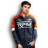 A man wearing a grey and orange custom premium softshell jacket with a logo on the front.