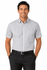 A short-sleeve button-up shirt in a grey and white check pattern, worn by a smiling man with dark hair.