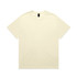 A cream-coloured heavy tee with a simple design and a logo at the neckline.