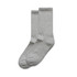 Two pairs of grey socks, featuring a ribbed design and a logo on one sock.