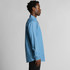 A blue denim shirt viewed from the side, featuring long sleeves and a collar, with a logo on it.
