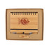 A bamboo notebook with a spiral binding, a pen, and a wooden USB drive, all packaged in a sturdy box.