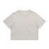A light beige cropped t-shirt featuring short sleeves and a round neckline. The shirt has a simple design and a logo.