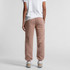 Track pants in a soft pink hue, featuring a relaxed fit and pockets, worn with a white t-shirt.