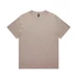 A heavy faded tee in a soft beige colour, featuring a plain design and a label at the neck.