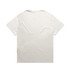 A plain light-coloured heavy faded tee with short sleeves and a relaxed fit, featuring a logo.