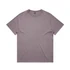 A heavy faded tee in a muted purple colour, featuring a simple crew neck and short sleeves. It has a logo tag.