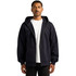 A navy zip-up hoodie is worn by a model, featuring a front zipper and a hood. The hoodie includes a logo.