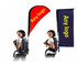 A double-sided teardrop banner in red and blue, displayed on a backpack. Each banner has a logo area.